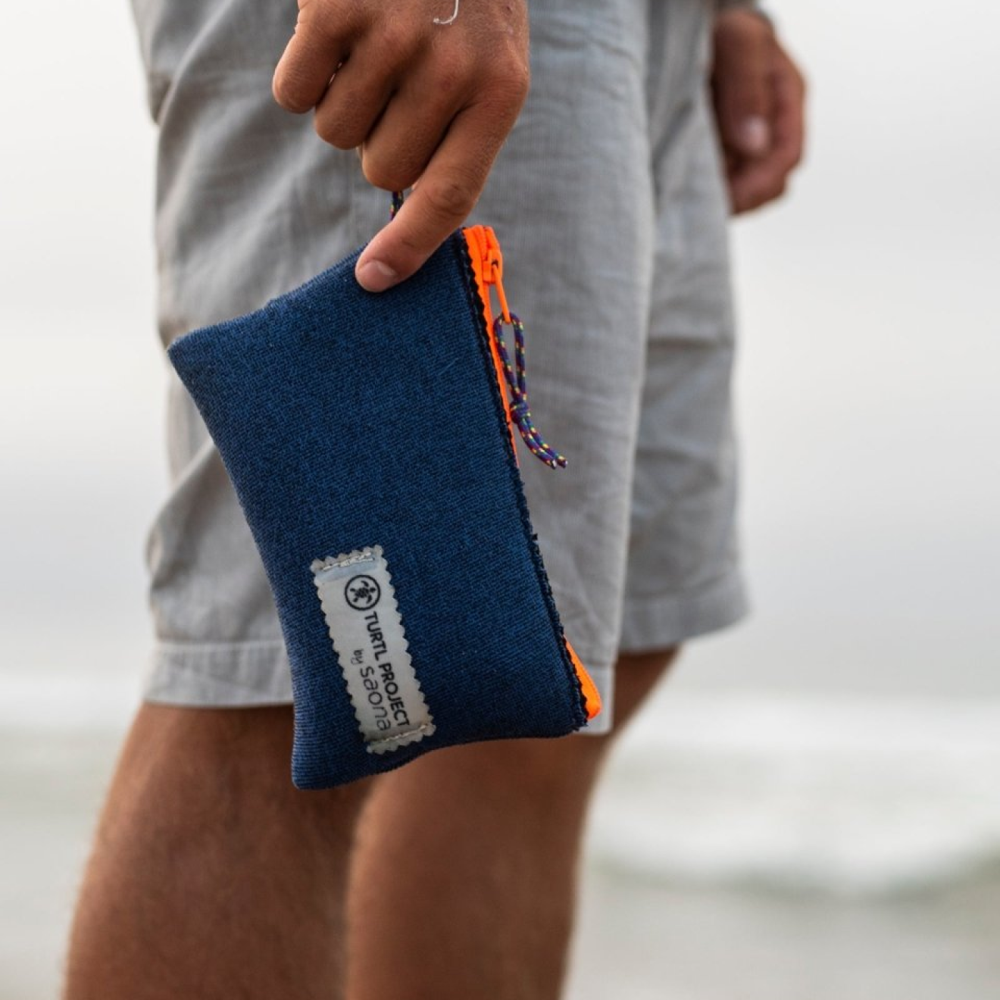 Man holding Turtl Project's recycled re-wallet